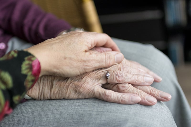 Volunteer helping elderly